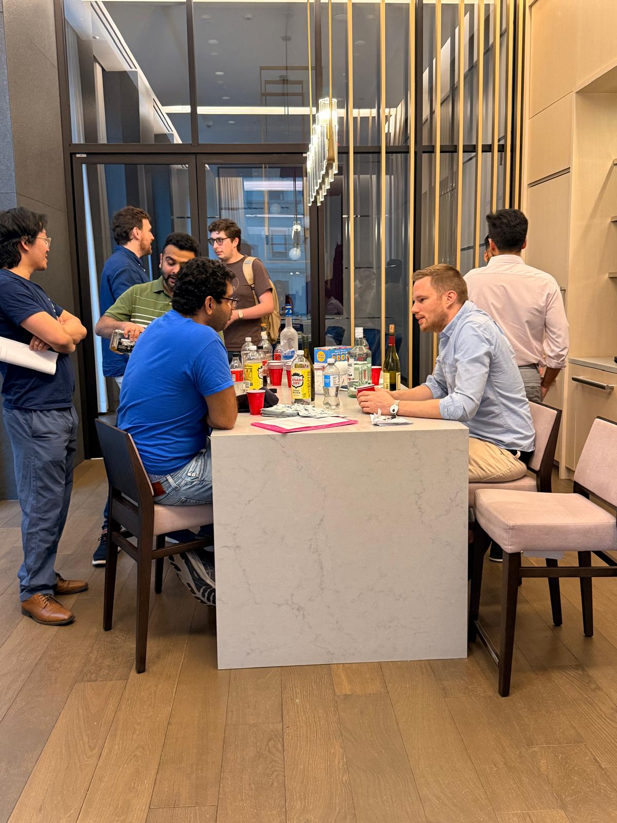 Founders in conversation around a marble table at Wavelength