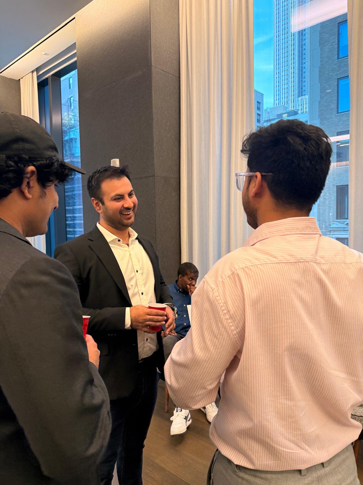 Two attendees connecting over drinks at Wavelength