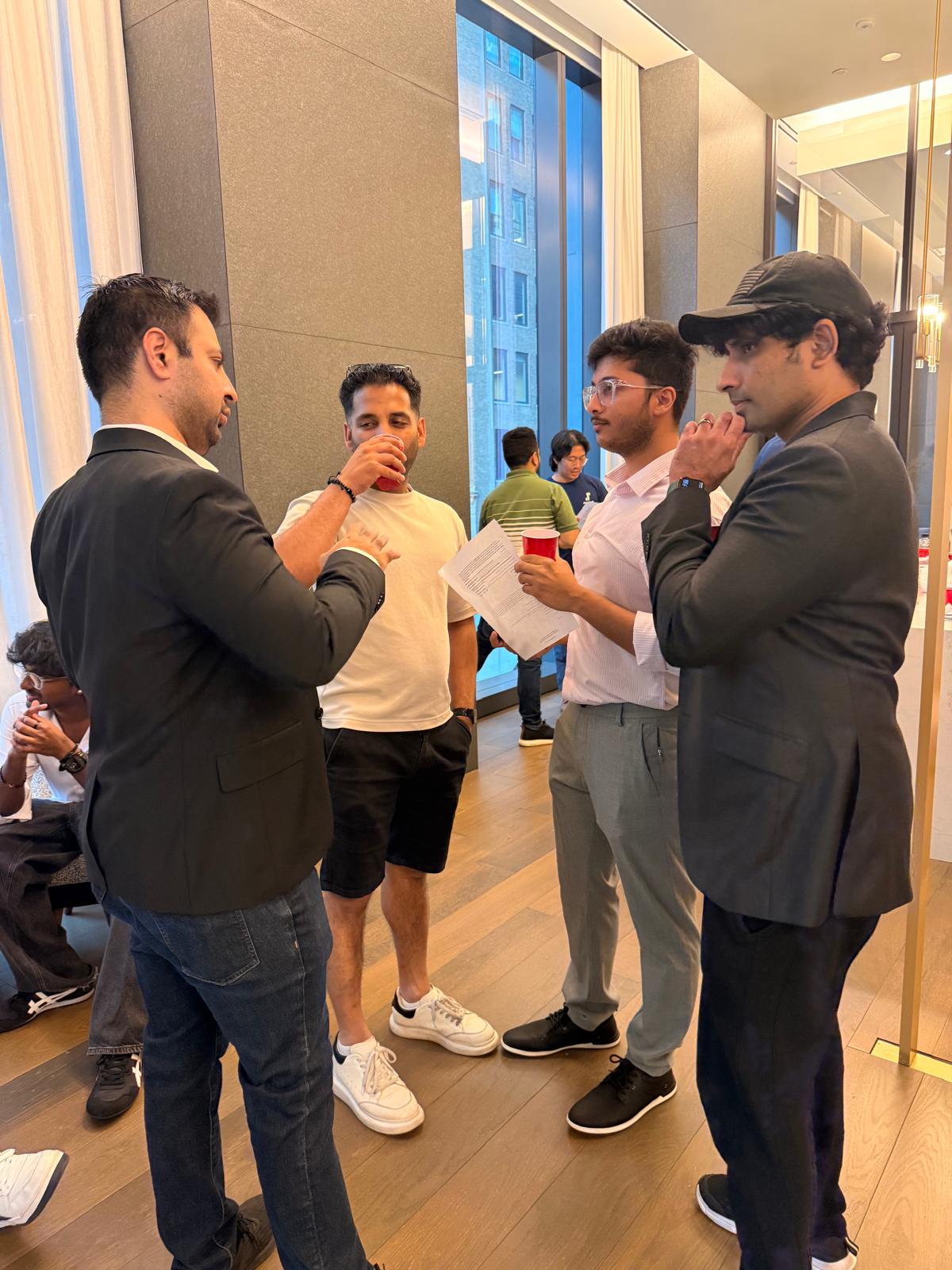 A circle of attendees in discussion at Wavelength